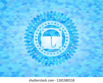 umbrella icon inside sky blue mosaic emblem