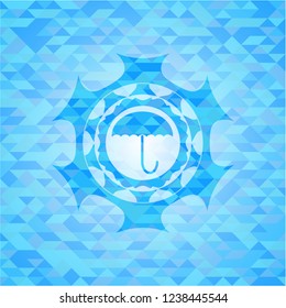 umbrella icon inside sky blue mosaic emblem