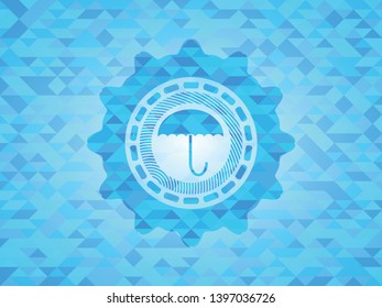 umbrella icon inside sky blue mosaic emblem
