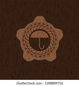 umbrella icon inside vintage wooden emblem