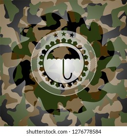 umbrella icon on camouflaged pattern