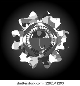 umbrella icon on grey camouflaged pattern