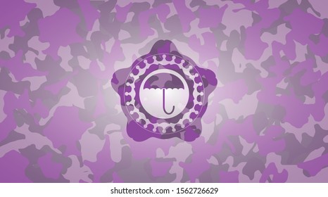umbrella icon on pink and purple camouflage pattern