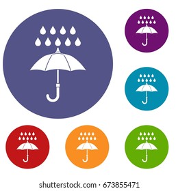 Umbrella and rain icons set in flat circle reb, blue and green color for web