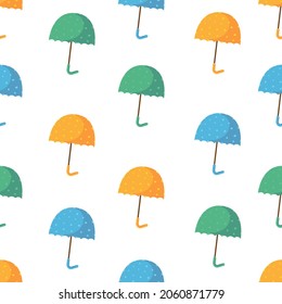 Umbrella seamless pattern. Cartoon colored umbrellas with polka dots on a white background.