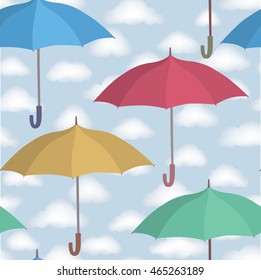 Umbrella seamless pattern. Cloudy sky tiling pattern. Rainy weather ornamental background