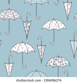 Umbrellas with different color patterns. Seamless cute vector illustration.