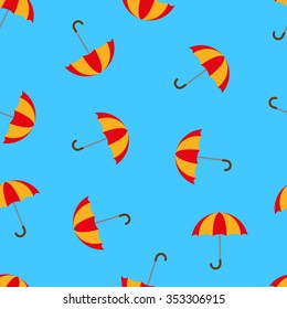 Umbrellas on blue background seamless pattern