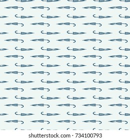 Umbrellas seamless pattern, vector background. Blue and green folded umbrellas on a blue background. For wallpaper design, wrappers, fabrics, decorating. Horizontally small umbrellas.