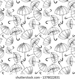 Umbrellas seamless sketch pattern. Black hand drawn umbrellas without background. Wallpaper pattern, doodle of umbrellas. Vector backdrop.