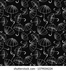 Umbrellas seamless sketch pattern. White hand drawn umbrellas on black background. Wallpaper pattern, doodle of umbrellas. Vector backdrop.