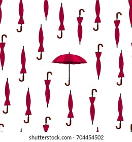 Umbrellas. Vector illustration. Seamless pattern. Repeating texture with red umbrellas. Fabric print.