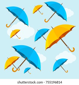 Umbrellas Yellow and Blue Fall on Sky Background Flat Design Style Symbol of Comfort. Vector illustration of Falling Umbrella