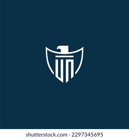 UN initial monogram logo for shield with eagle image vector design