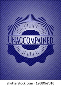 Unaccompained badge with denim background