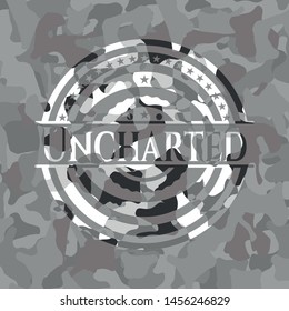 Uncharted written on a grey camouflage texture