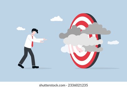 Unclear target, lack of specific business goal or direction, confusion and inefficiency due to poor business vision concept, Businessman frustrated with clouds obscuring target.