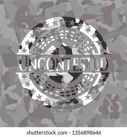Uncontested written on a grey camouflage texture