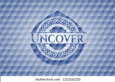 Uncover blue emblem with geometric pattern.