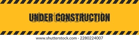 under construction background. under construction sign background with black and yellow stripes. black and yellow stripes warning caution sign.