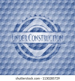 Under Construction blue polygonal badge.