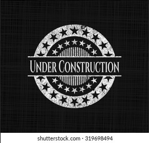 Under Construction chalk emblem written on a blackboard