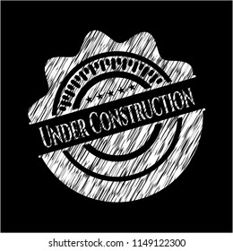 Under Construction chalkboard emblem on black board