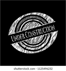 Under Construction chalkboard emblem written on a blackboard