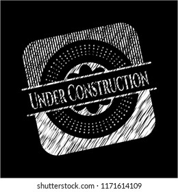 Under Construction chalkboard emblem written on a blackboard