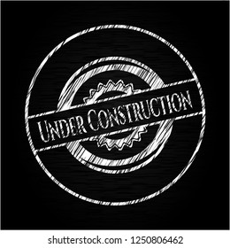 Under Construction chalkboard emblem written on a blackboard