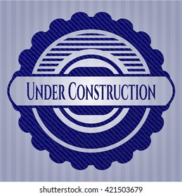 Under Construction emblem with denim texture