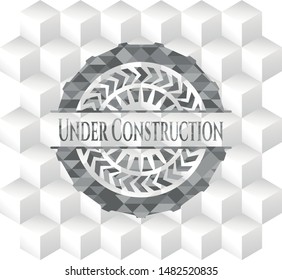 Under Construction grey emblem. Vintage with geometric cube white background