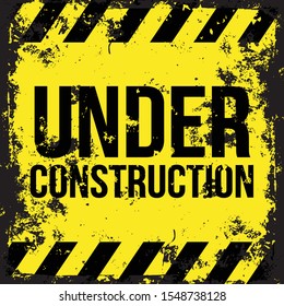 Under construction grunge sign vector