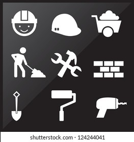 under construction icons over black background