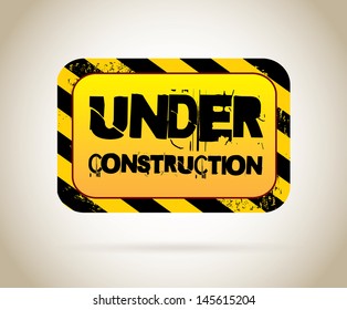 under construction label over beige background vector illustration