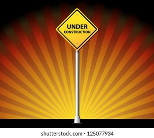 Under construction road sign on rays background