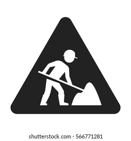 Under construction sign with man digging ground