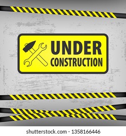 Under construction sign on gray ground background. Vector illustration for website. Under construction rectangle with a hammer and a wrench. Process of building.  EPS10.