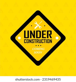 Under construction sign on yellow background