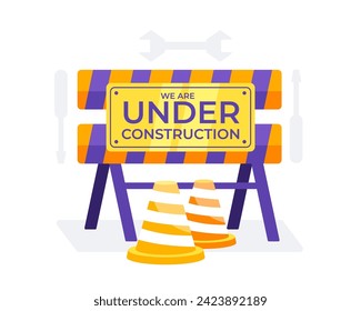 Under Construction sign with orange and white traffic cones and construction barriers
