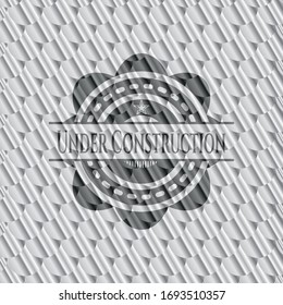 Under Construction silver emblem or badge. Scales pattern. Vector Illustration. Detailed.