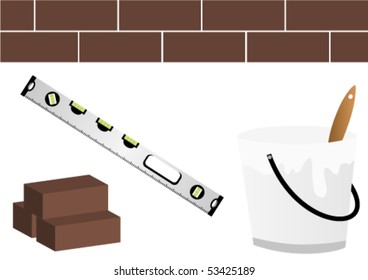 Under construction site with level, bucket and wall