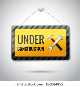 Under construction symbol with hammer and spanner  web site page temporal icon or emblem