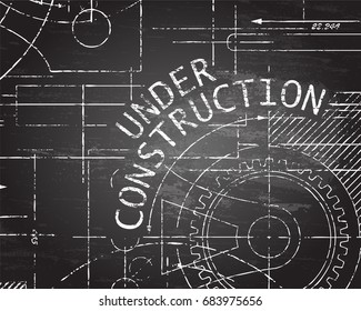 Under construction text with gear wheels hand drawn on blackboard technical drawing background
