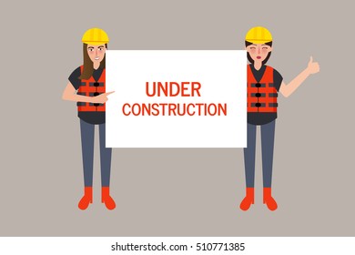 under construction worker holding sign 