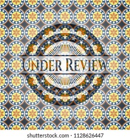 Under Review arabic badge. Arabesque decoration.