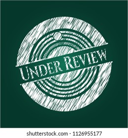 Under Review with chalkboard texture