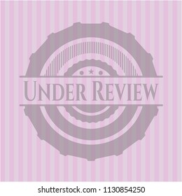Under Review pink emblem