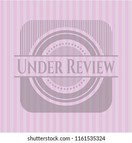 Under Review pink emblem