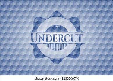 Undercut blue emblem with geometric pattern.